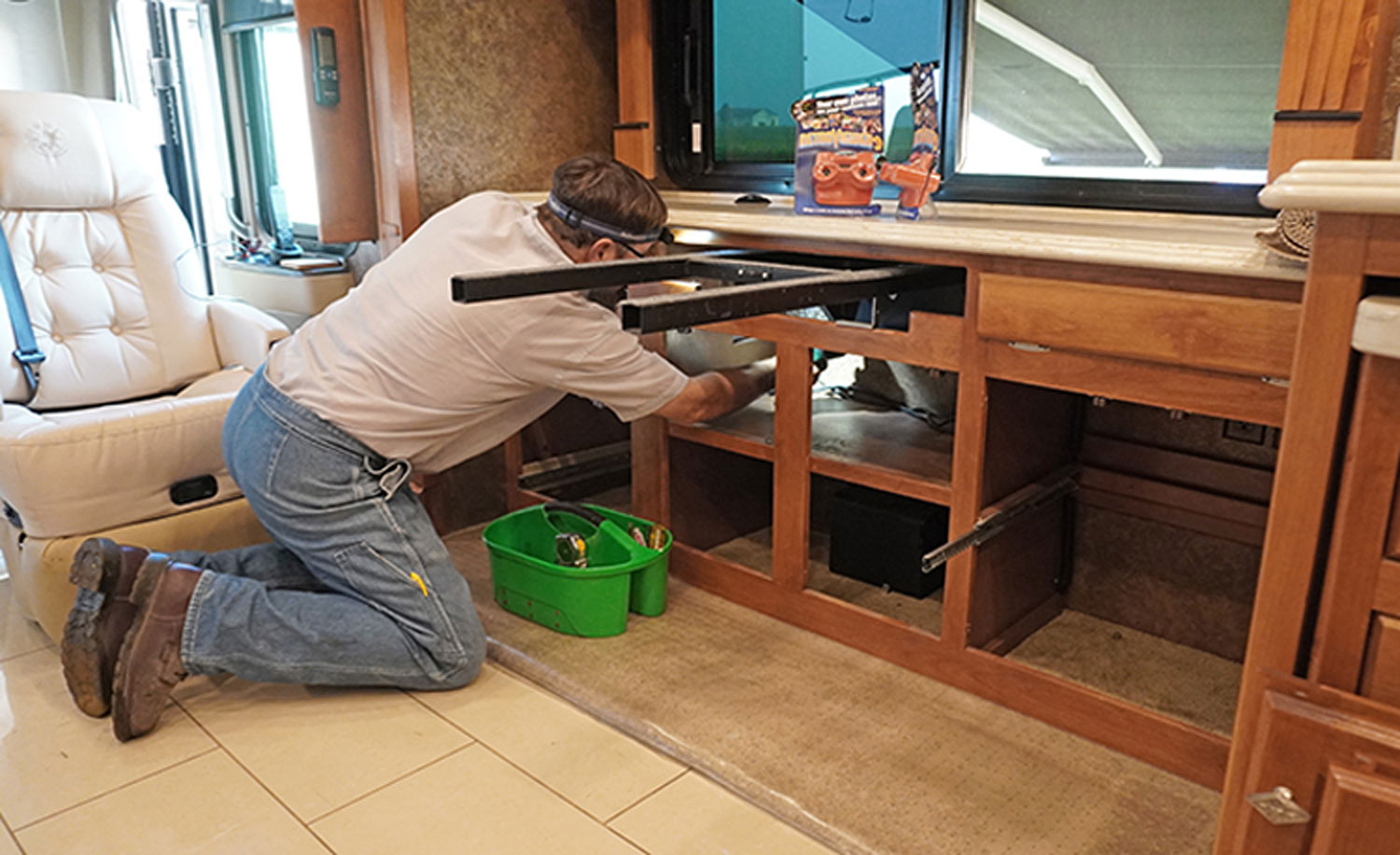 mechanic dismantles the dining structure starting with the cabinetry