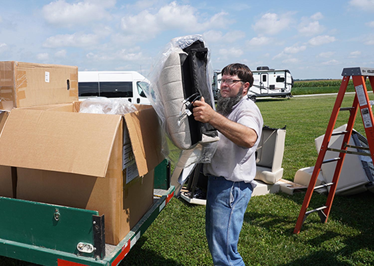 Borkholder removes furniture from a wagon