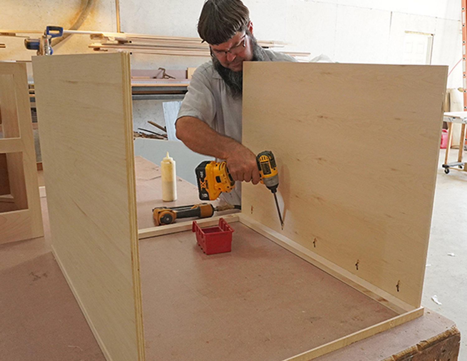 Borkholder works on the larger cabinet