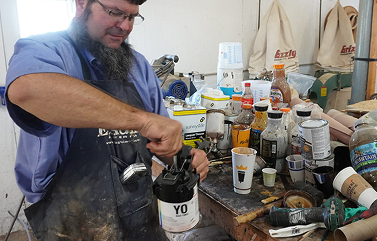 mechanic prepares industrial grade stains