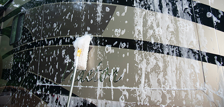 the surface being sprayed with foam