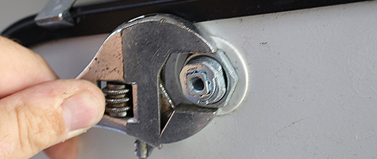 13a: The large nut is installed to hold the cam lock in the compartment door