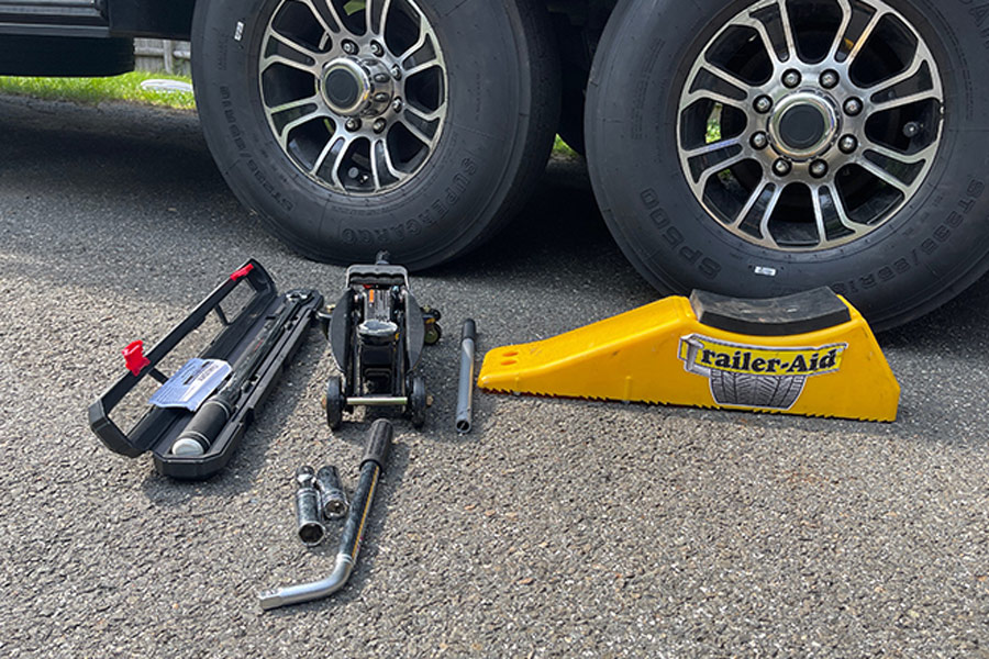 torque wrench, a trolley jack (small floor jack), wrench, thin-wall socket and a Trailer Aid PLUS