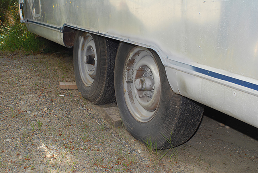 trailer flat tires in the dirt