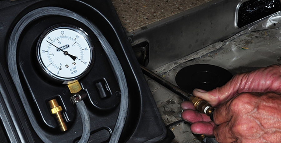 pressure gauge being checked