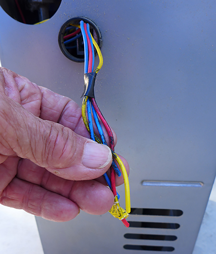 two blue wires being held in hand