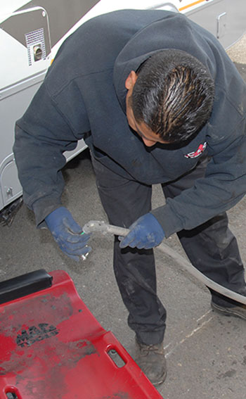 Because the new generator does not come with wiring conduit and its attendant hardware, they are removed from the original unit. The 90-degree fitting is removed first and the conduit slid off