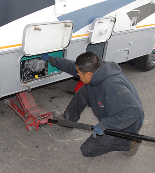 The floor jack is once again employed to lift the new generator in place, and the disassembly procedure is reversed