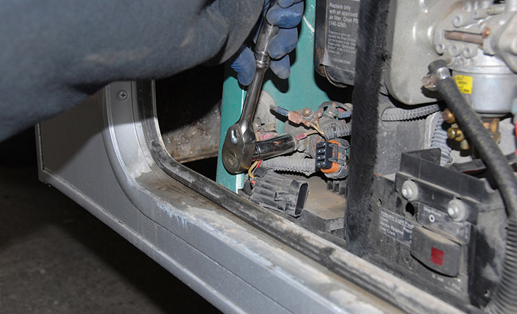 Next, the battery power cable is disconnected