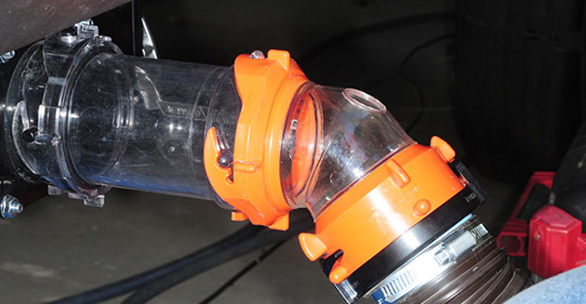 A new elbow fitting configured by RV Flush to accept the hose and nozzle was fit into place