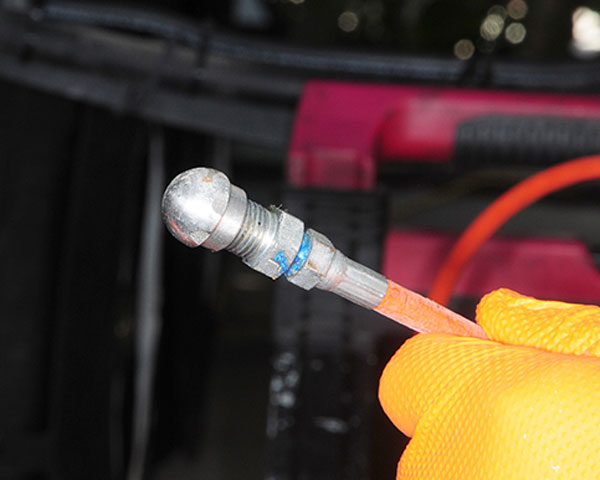 The nozzle has a number of holes, which directs the water — under 3,500 psi of pressure — to all areas inside the tank