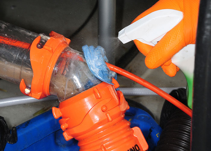 A strong odor eliminator and disinfectant is sprayed on the towel many times throughout the process, necessary to stay safe during the flushing process