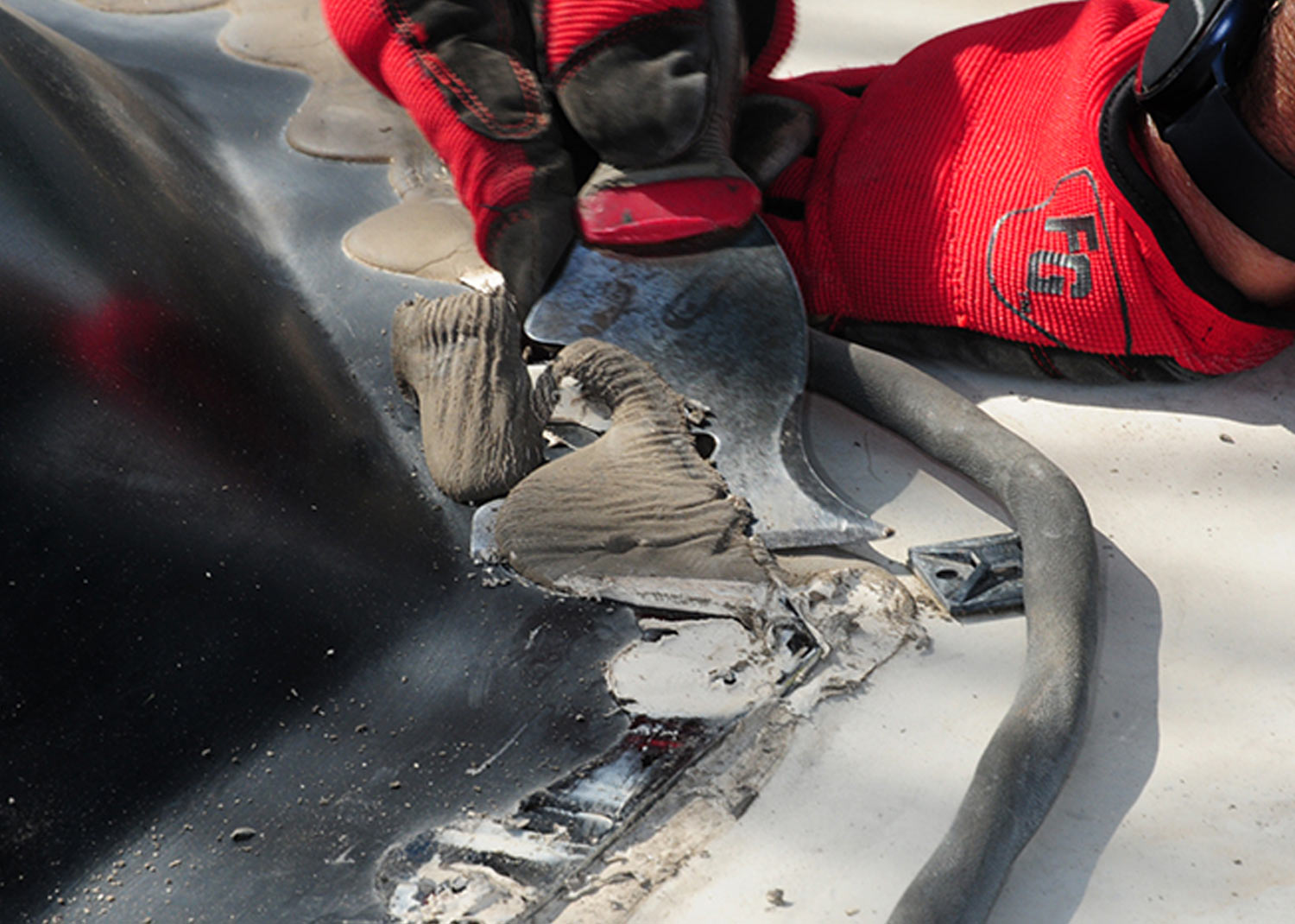 the old sealant begins pealing off in larger pieces