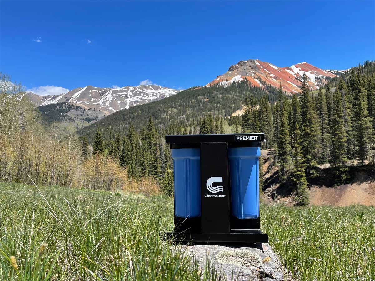 Clearsource Premier Water Filter System on a rock with the a mountain vista in the background