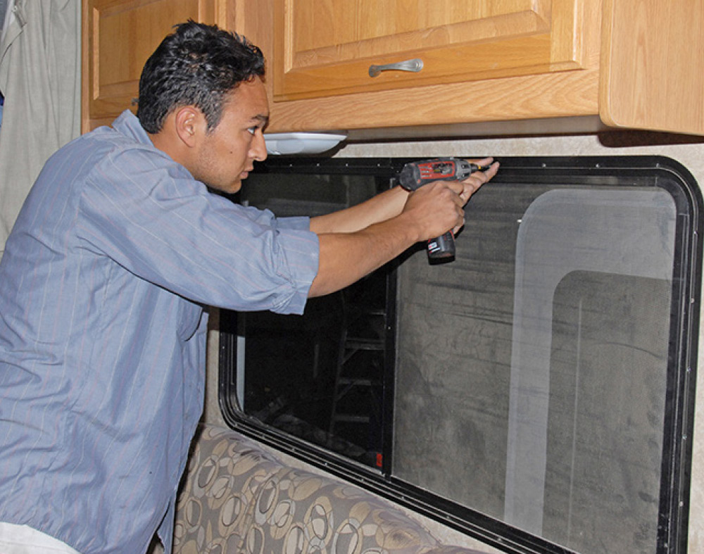 Next, the screws that secure the window flange to the wall are removed