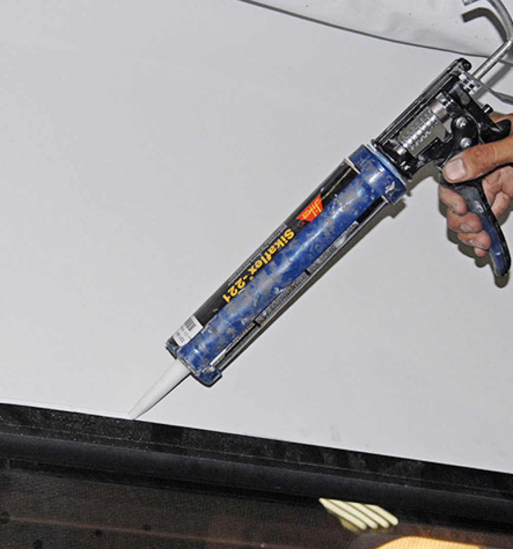 The final step is a thin bead of white calking around the top edge of the window to further ensure against water intrusion