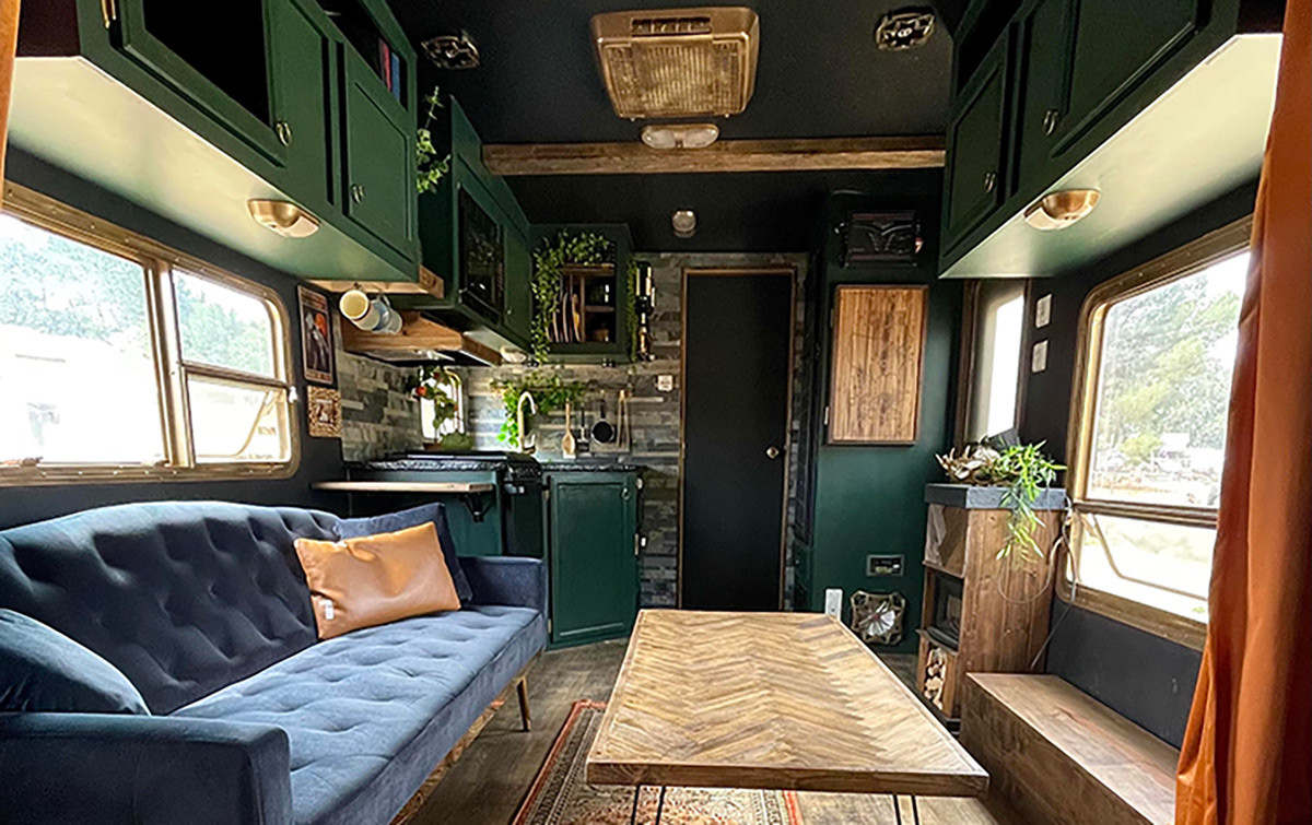 rv with Green cabinets, a black ceiling, luxury vinyl plank flooring, residential furnishings and carpet runner