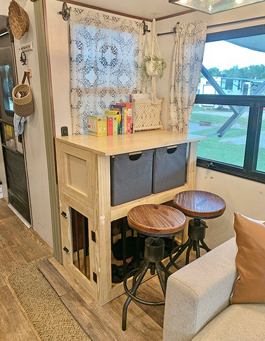 dining area with a hutch at the end of the couch
