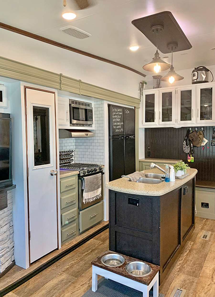 the pantry door painted white, the lower cabinets painted sage green