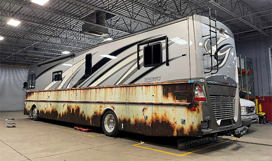 full profile view of National Lampoon’s Christmas Vacation rust inspired graphics on bottom half of rv