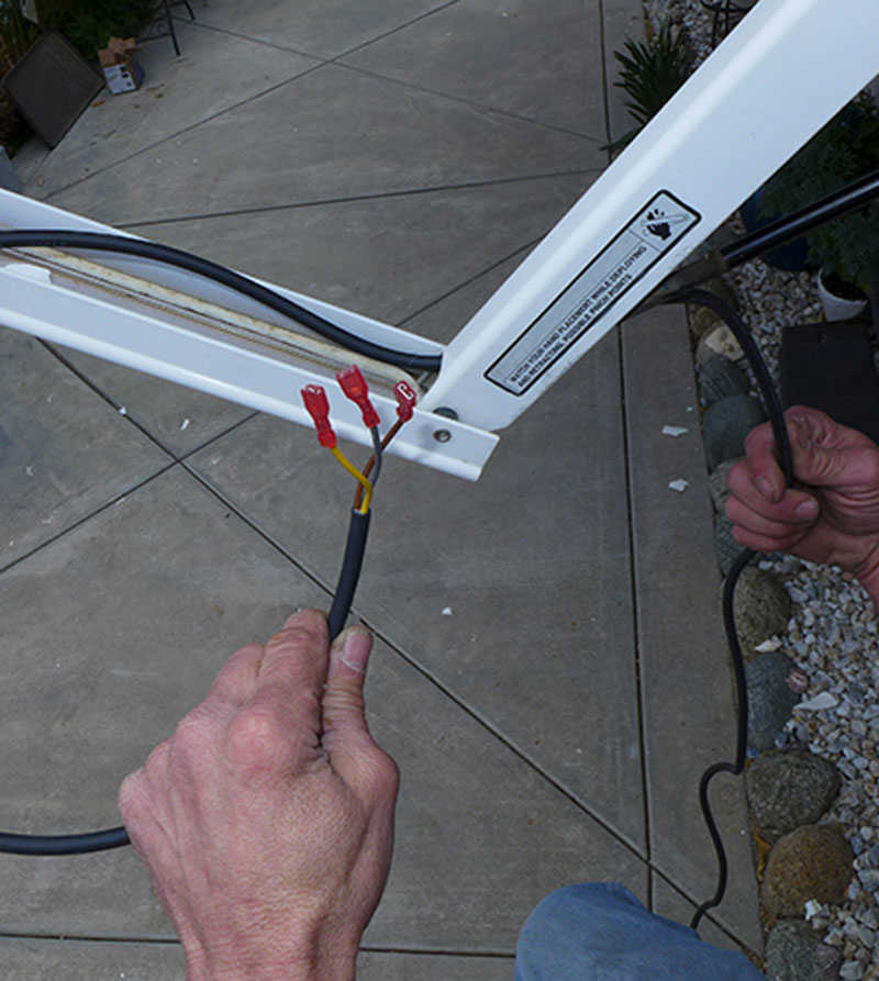 The wiring harness in the kit is installed in a specific channel in the awning hardware