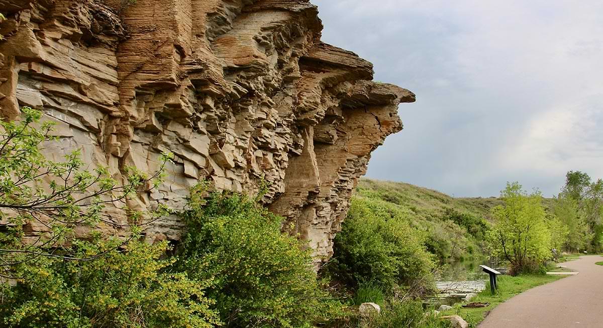 angled view of rock ledges jutting out along the River’s Edge Historic Trail