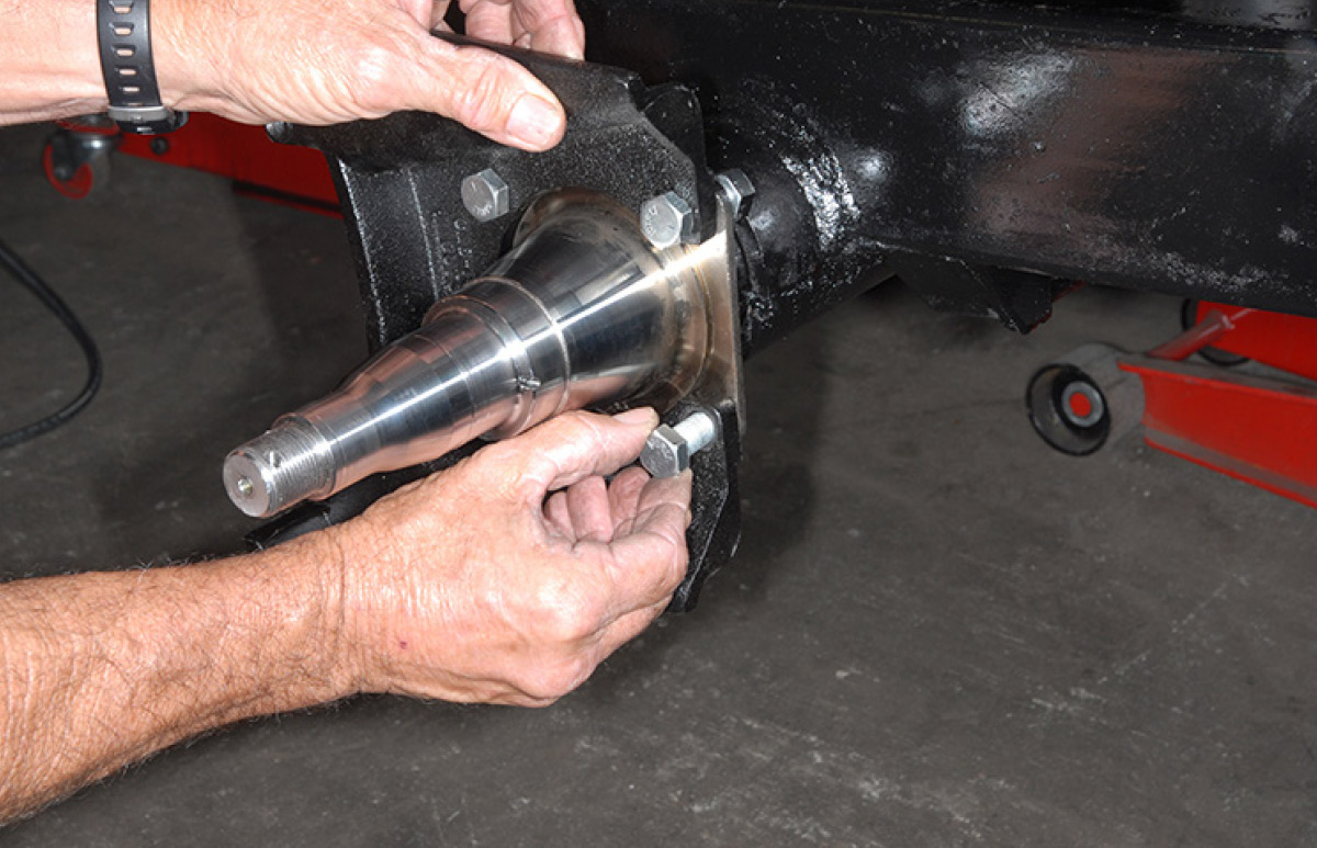 The caliper mounting brackets are positioned and bolted