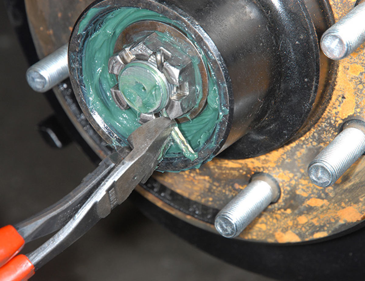 After the tires are replaced, spin the wheels a number of times to check again for end play