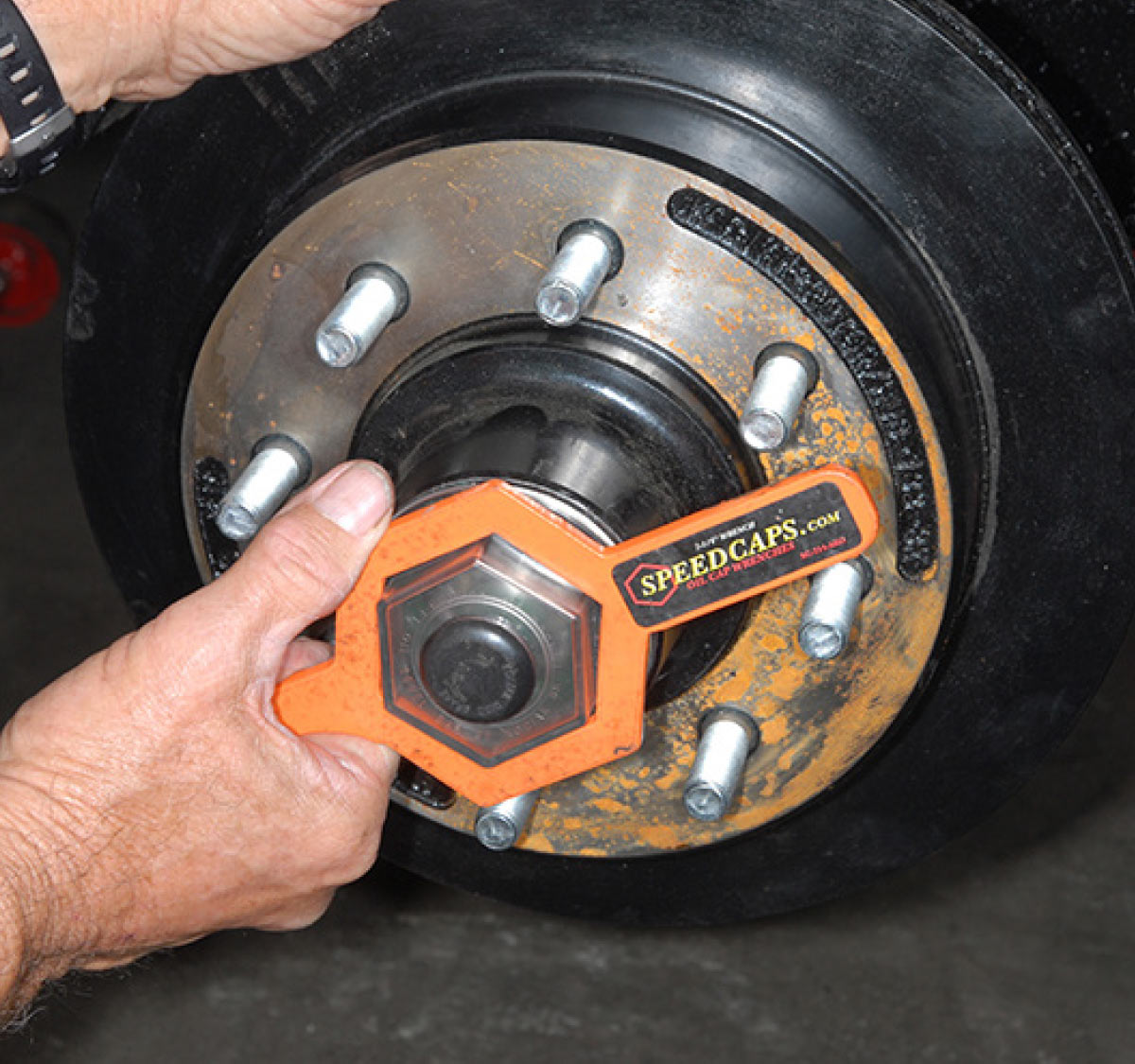 This hub uses a threaded dust cap, which can be replaced with a tool designed for this purpose