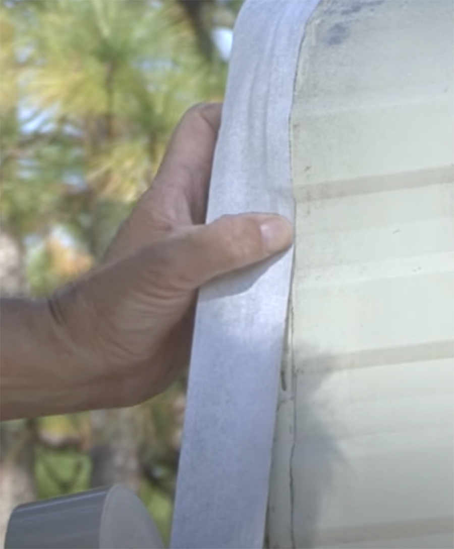 the corner seal tape being applied