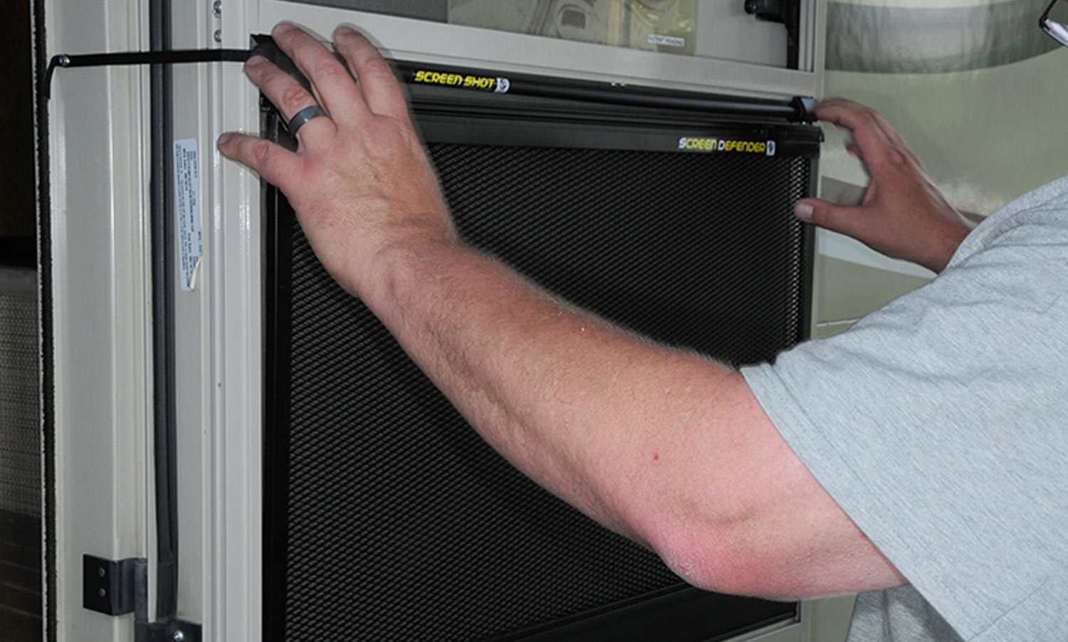 once the Screen Defender is in position, the spring-loaded latches are employed, locking the metal mesh in place