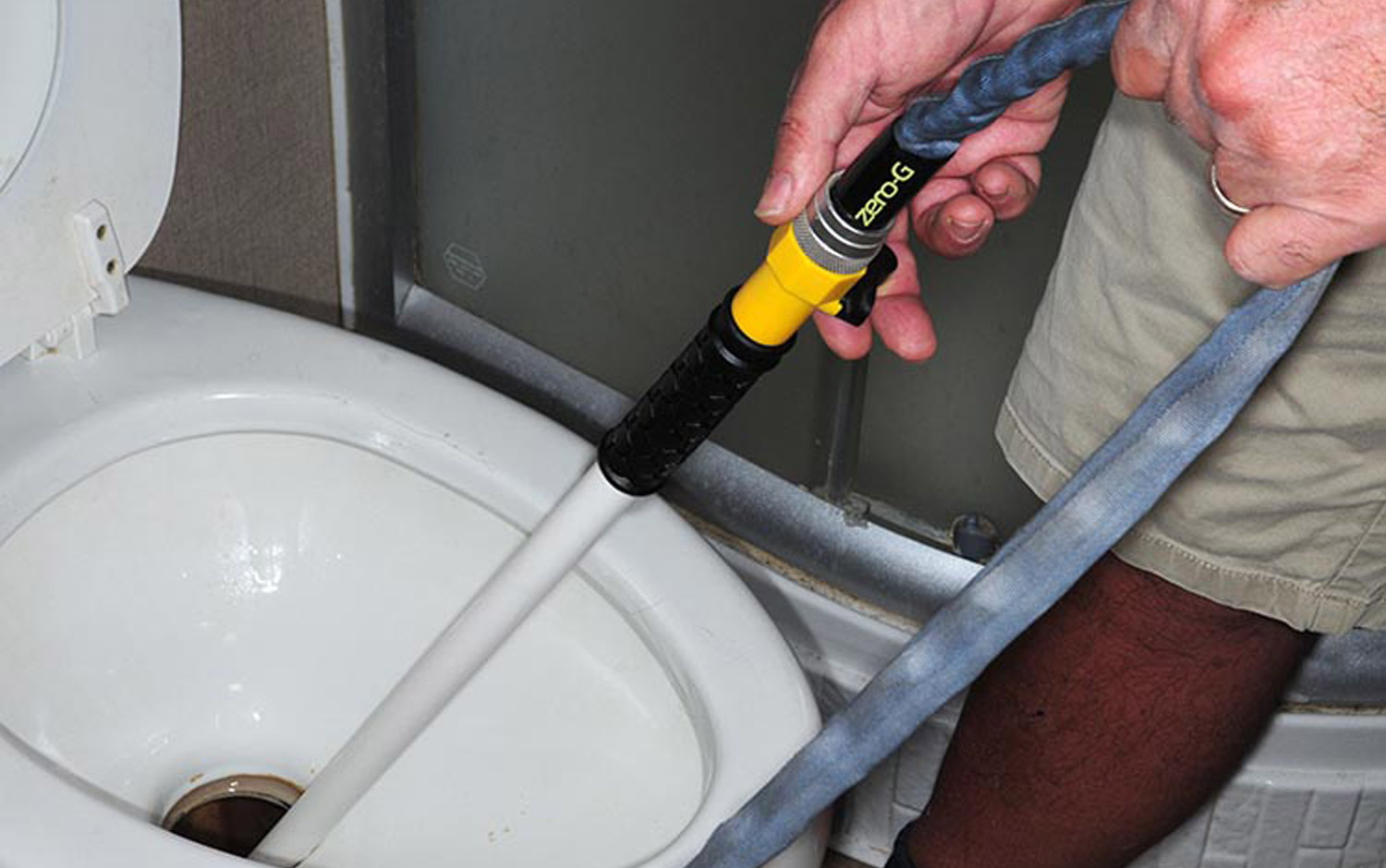 the Swivel Stik being used in a toilet