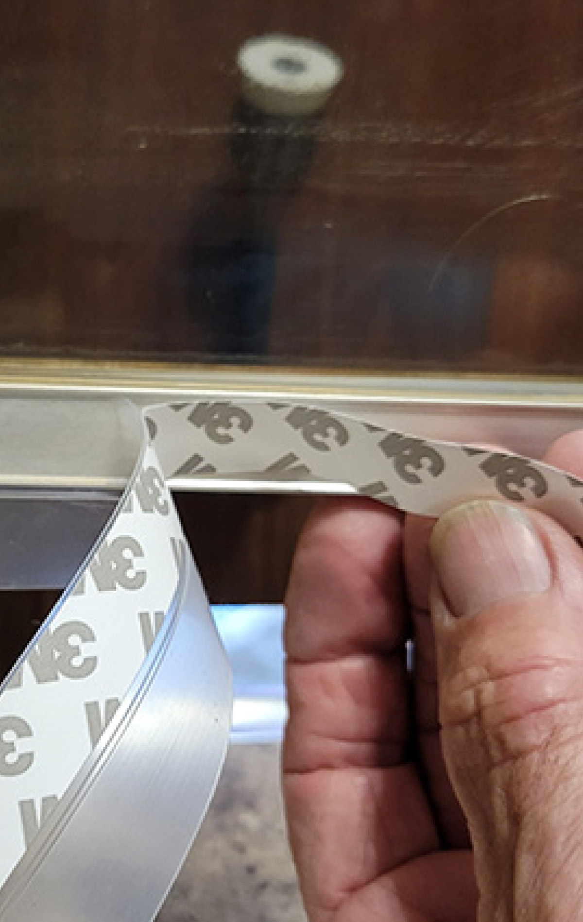 Apply the seal strip on the shower-door frame a little at a time
