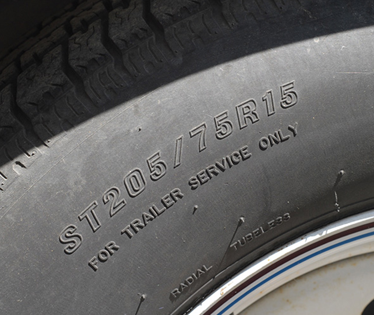 A trailer tire’s size is preceded by the letters