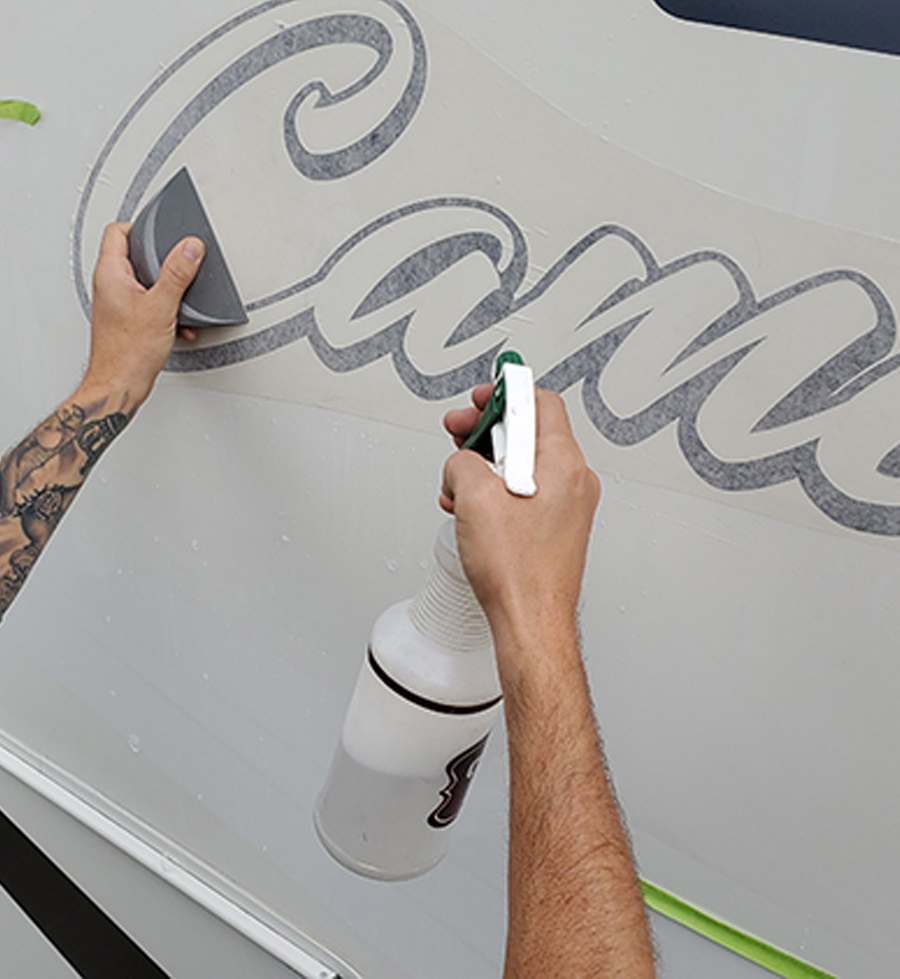 A mixture of water and baby oil is sprayed on the outside protective paper