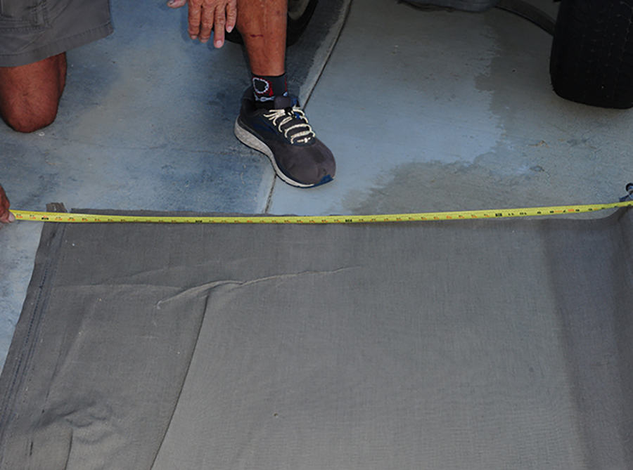 existing fabric being measured on the ground