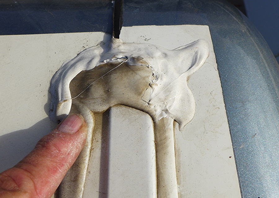 Another bad patch job made extra work when removing the old caulking