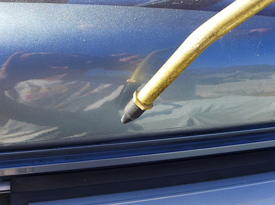 The gap where the roof material meets the sidewall molding needed to be cleaned out with high air-pressure through an extended nozzle