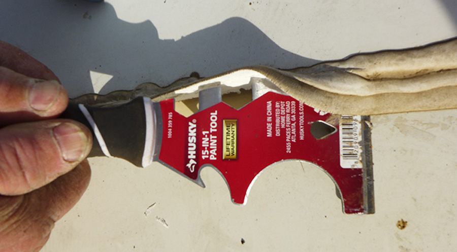 If an oscillating tool is not available, using a high-quality putty knife will require more effort and repetitive motion, but it will get the job done
