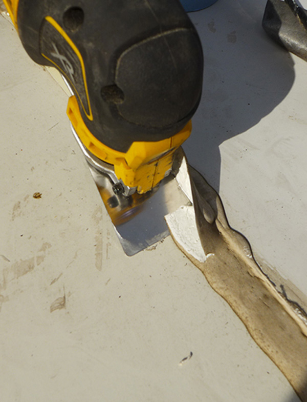 The oscillating tool makes short work of the old-sealant removal process