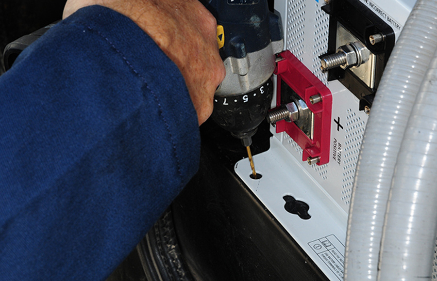 Pilot holes were drilled through the openings in the front flange
