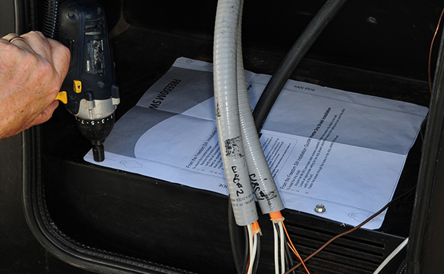 tighten the lag bolts through the marked positions in the paper