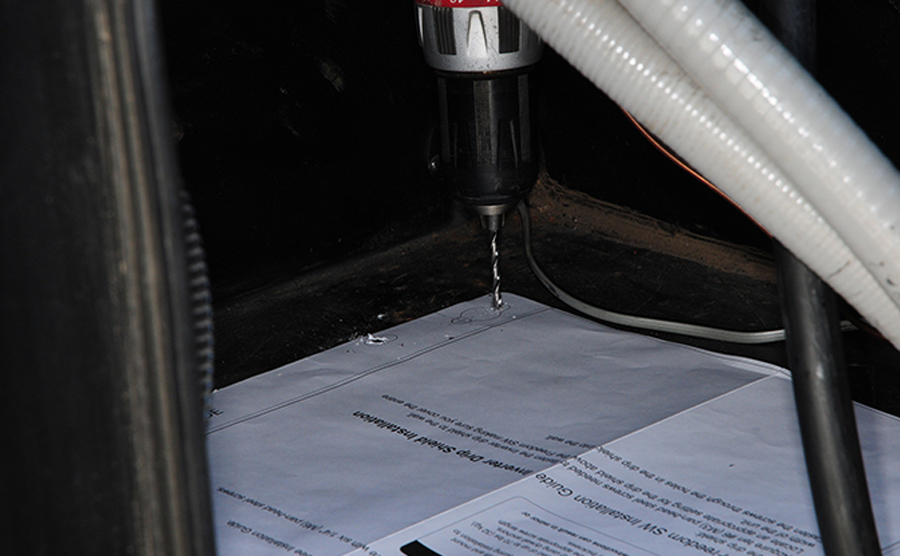 rear holes being drilled through the template