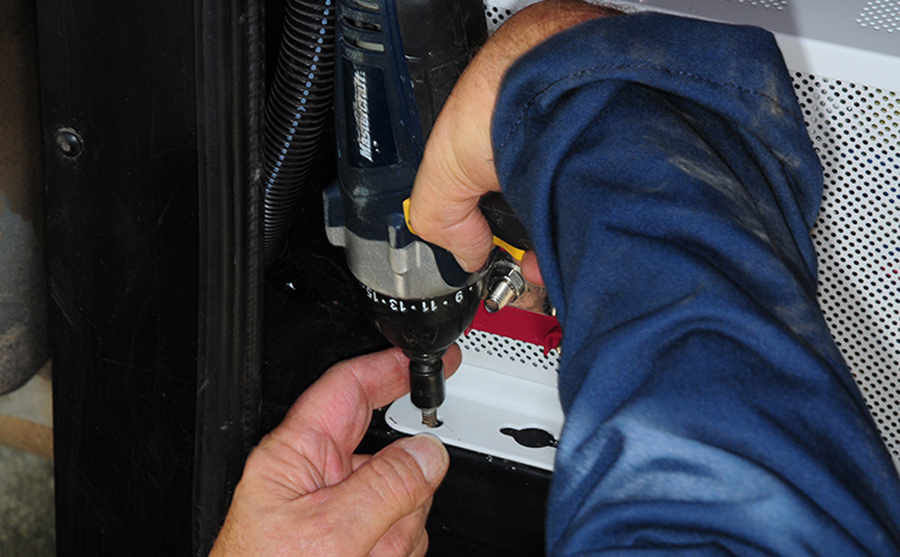 install the rear flange bolts to the compartment floor