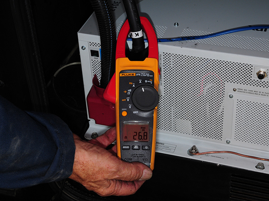 inverter/charger was turned on and battery charging was checked with a clamp-on amp meter