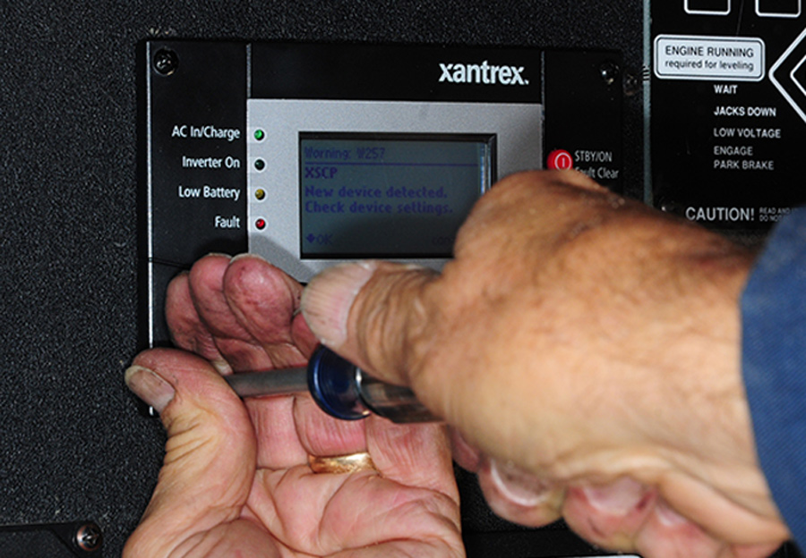 provided screws were used to secure the panel into the wood backing inside the access compartment