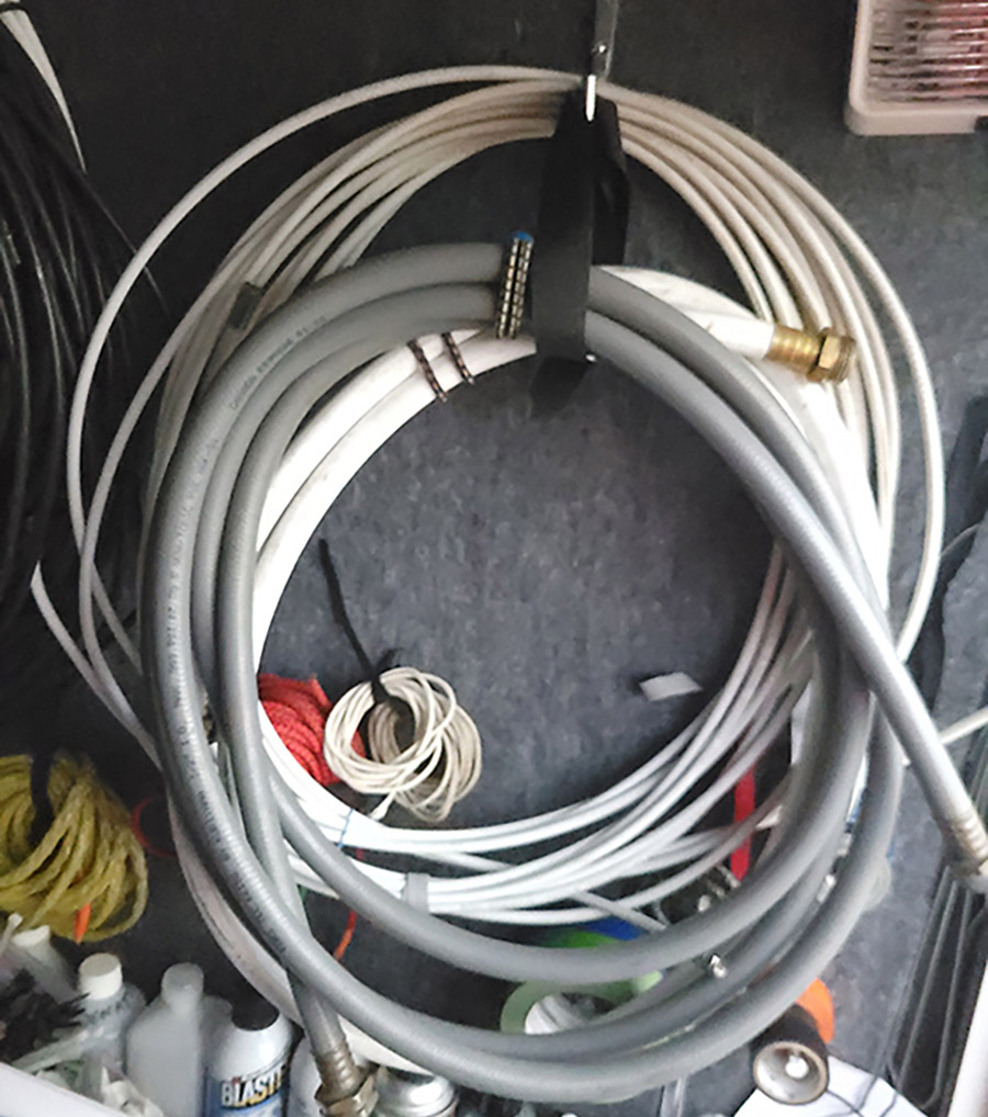 hose hanging from a wall for storage space