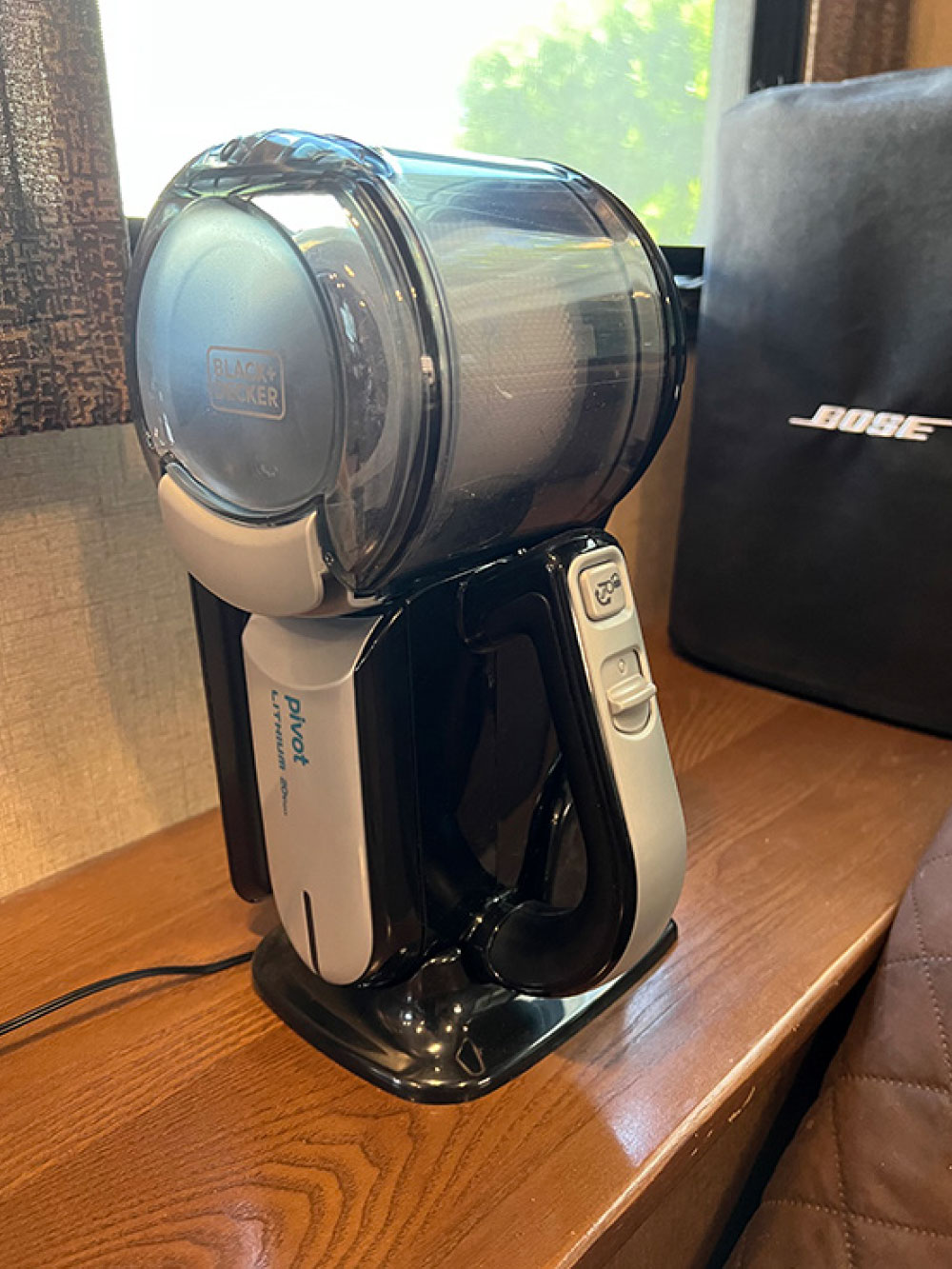The cordless handheld vacuum fits neatly into the charging cradle