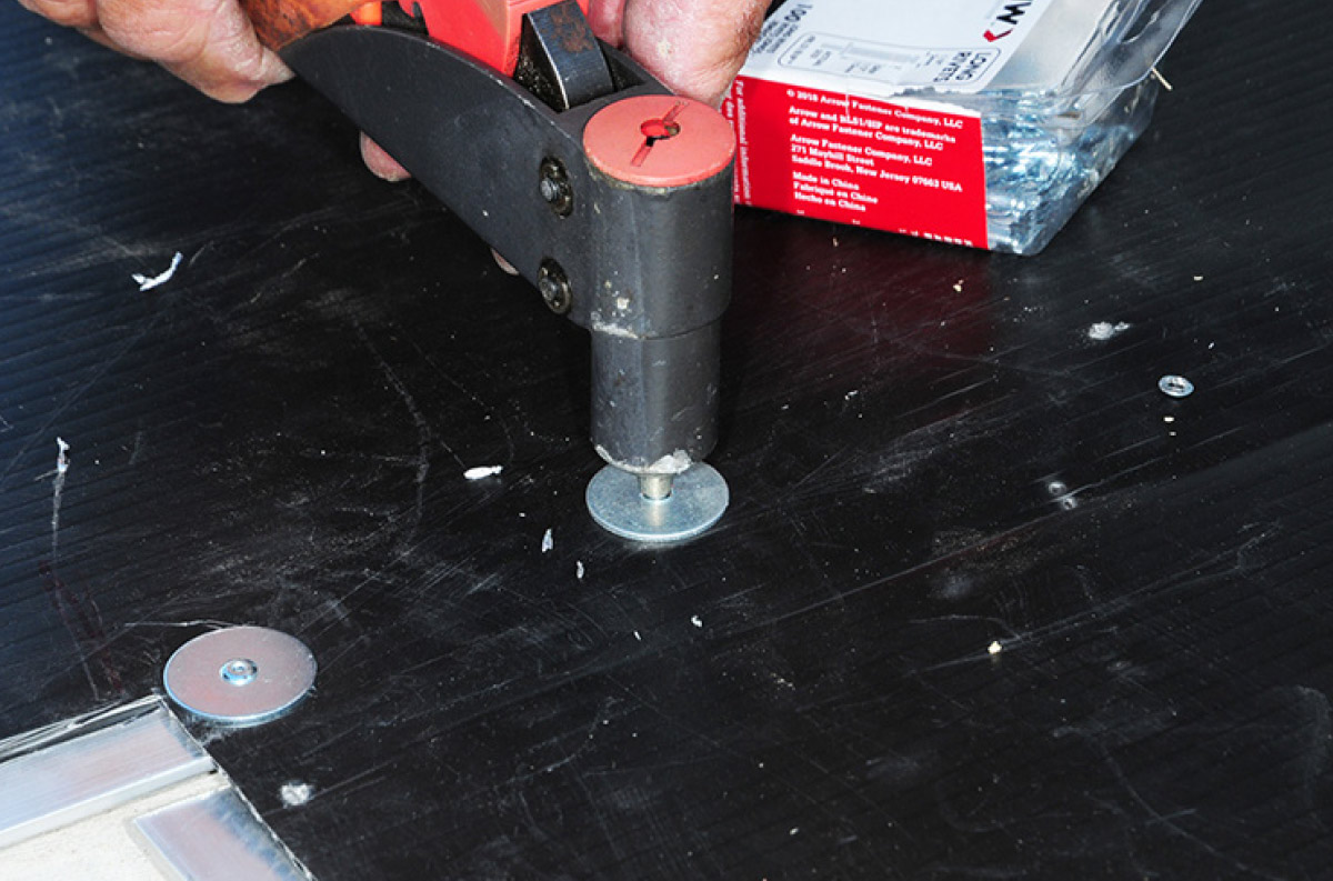 The flat aluminum strips framing the openings for the access panels
