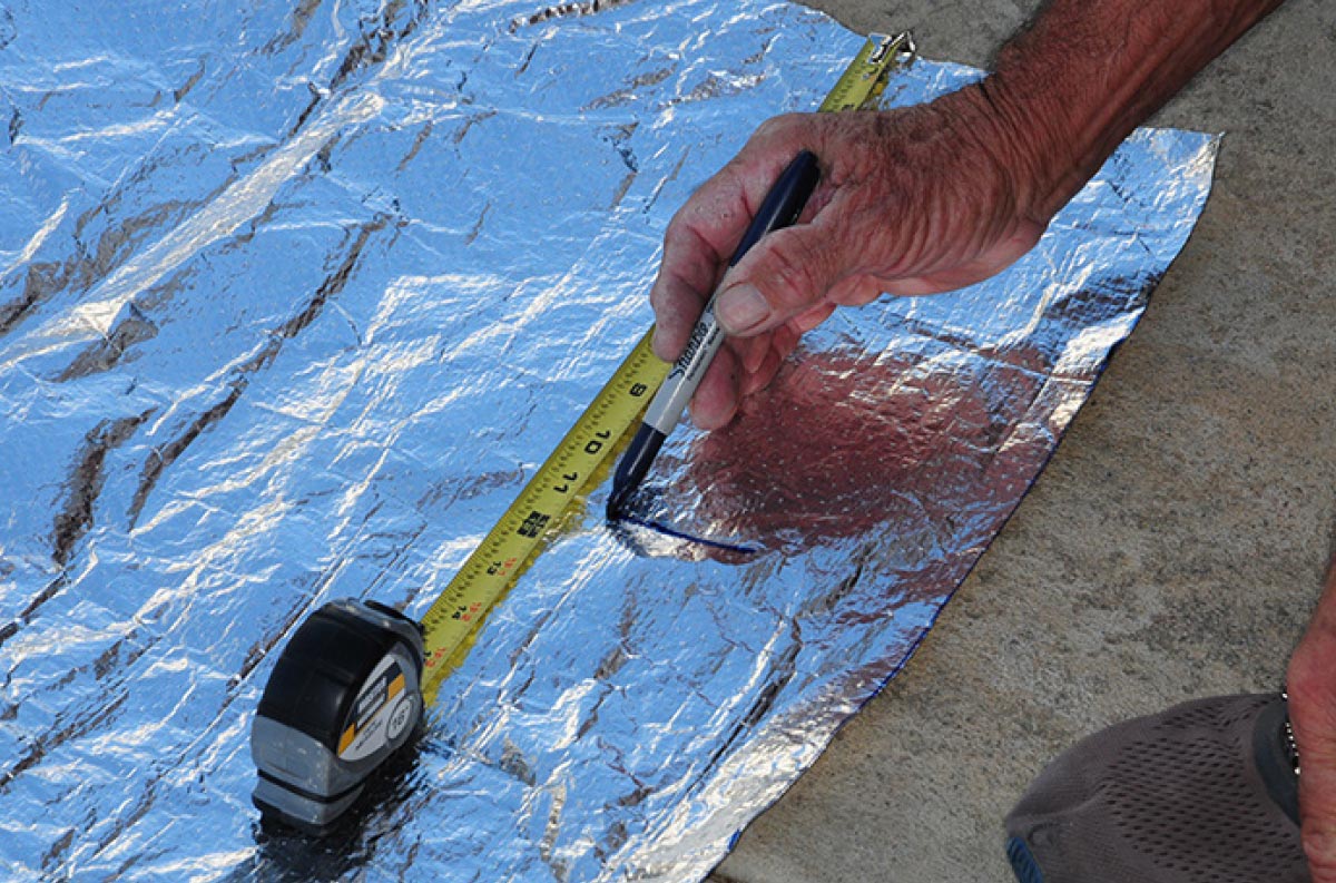 Aluminum insulation was cut to fit the entire underside of the Coroplast material